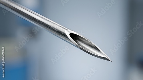 Close-up of a sterile medical hypodermic needle tip in focus