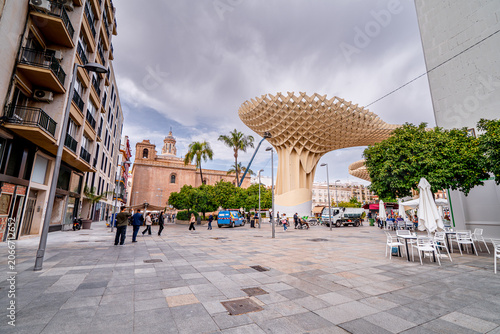 Futuristic wooden Setas de Sevilla building in Plaza de la Encarnación with people, Seville, Spain, Andalusia.