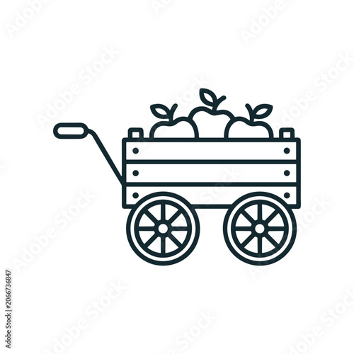 Wooden wagon with green apples.