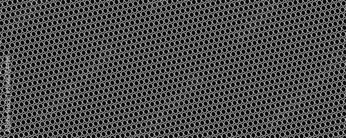 Black circular dots on white background. Mosaic holey print. Perforated metal texture. Peg board, radiator or speaker grill surface with repeated round holes. Vector graphic illustration.