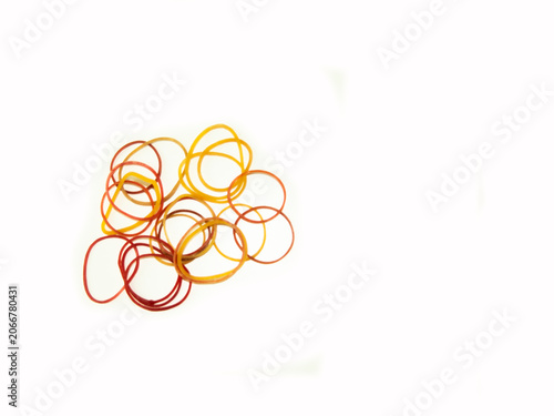Pile of colorful tangled rubber bands isolated on white, metaphor of complexity and chaos