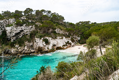 Fotografie Stunning horizontal view of a hidden Mediterranean cove in Menorca with vibrant