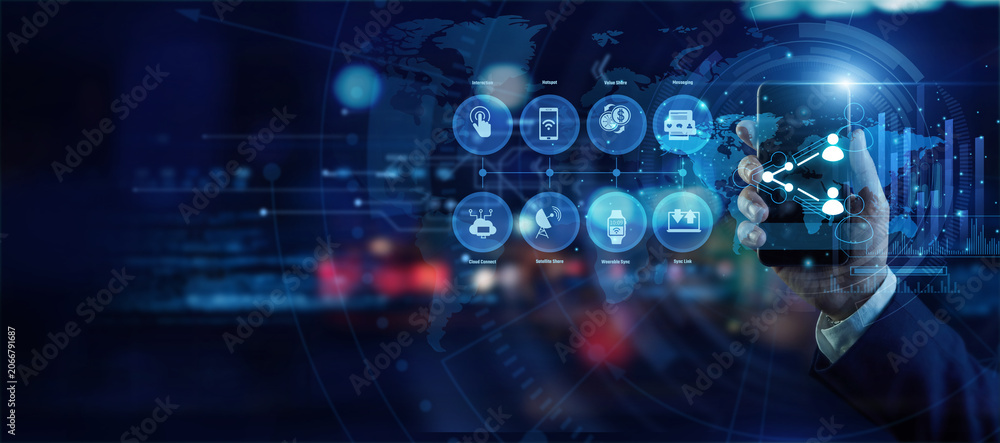 Fototapeta premium Network manager holding a mobile phone analyzing global Connection and Sharing data on a holographic world map. Futuristic technology, secure network connections, and advanced data visualization.