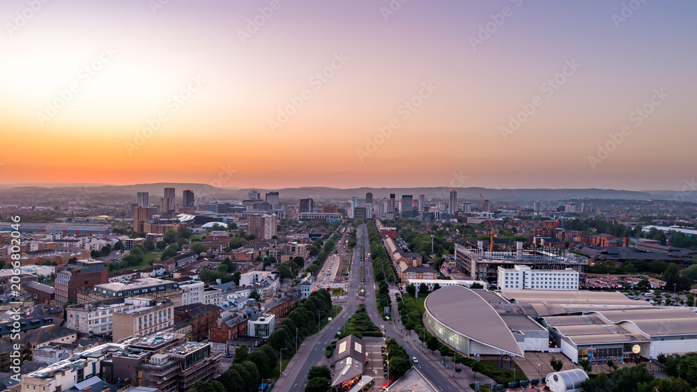 Αυτοκόλλητο Aerial view looking down Lloyd George Avenue toward the Cardiff city centre skyline at sunset