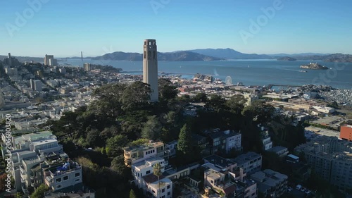 Cinematic drone footage orbiting around Coit Tower on Telegraph Hill in San Francisco. Smooth aerial movement showcasing the iconic Art Deco landmark.