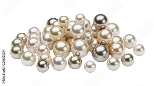 A large collection of lustrous white and cream pearls piled together in a heap, isolated on a solid black background, showing round shapes
