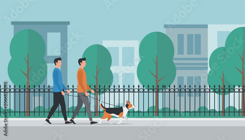 Two young men walking their beagle dog on a leash along a city park pathway with trees and buildings in the background.