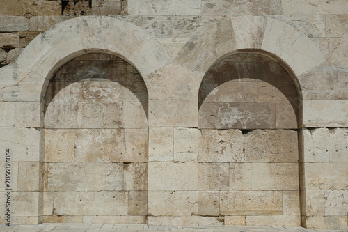 Valokuva A detailed view of two massive ancient stone archways on the lower level of the Odeon of Herodes Atticus facade in Athens Greece
