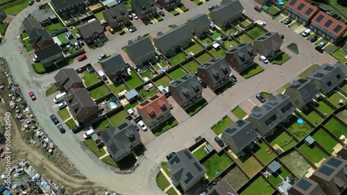Noble Homes at Knottingley is featured from above. The video shows the layout of homes, roads, and green spaces in the area. Many cars are parked by the houses