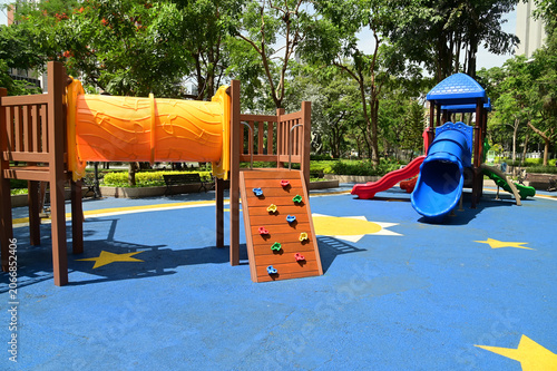 Climbing structures, tunnels, and slides are playground equipment for children, and are part of the park.