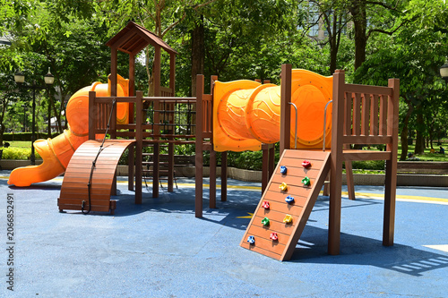 Climbing structures and slides are playground equipment for children, which are part of the public park in Bangkok capital city , Thailand.