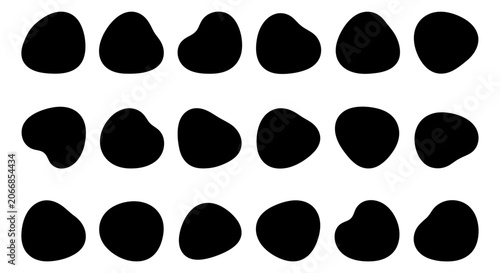 Fotografía Collection of black organic pebble shapes and abstract fluid blob silhouettes on white background