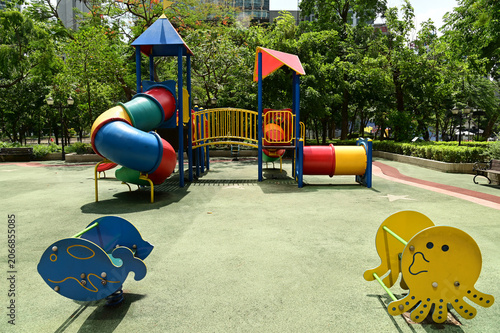 Climbing structures and slides are playground equipment for children, which are part of the public park in Bangkok capital city , Thailand.