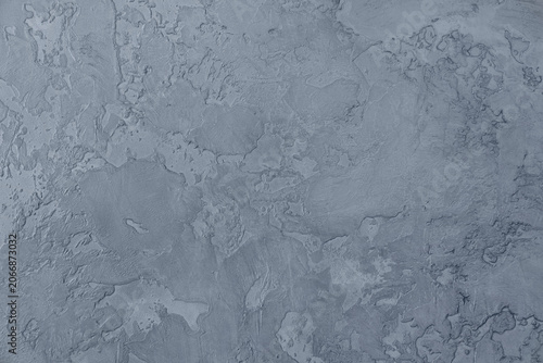 Abstract monochrome gray Venetian plaster wall texture background, textured concrete backdrop with expressive stucco strokes, wall with hyper-textural surface