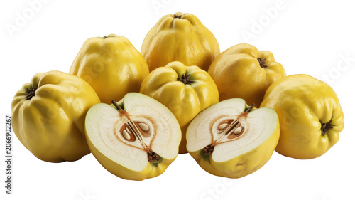 Ripe yellow quince fruits piled together with two halves showing the seeds and core, isolated on a black background, fresh organic autumn harvest