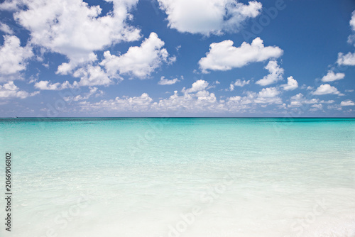 Light blue water sea and blue sky with clouds