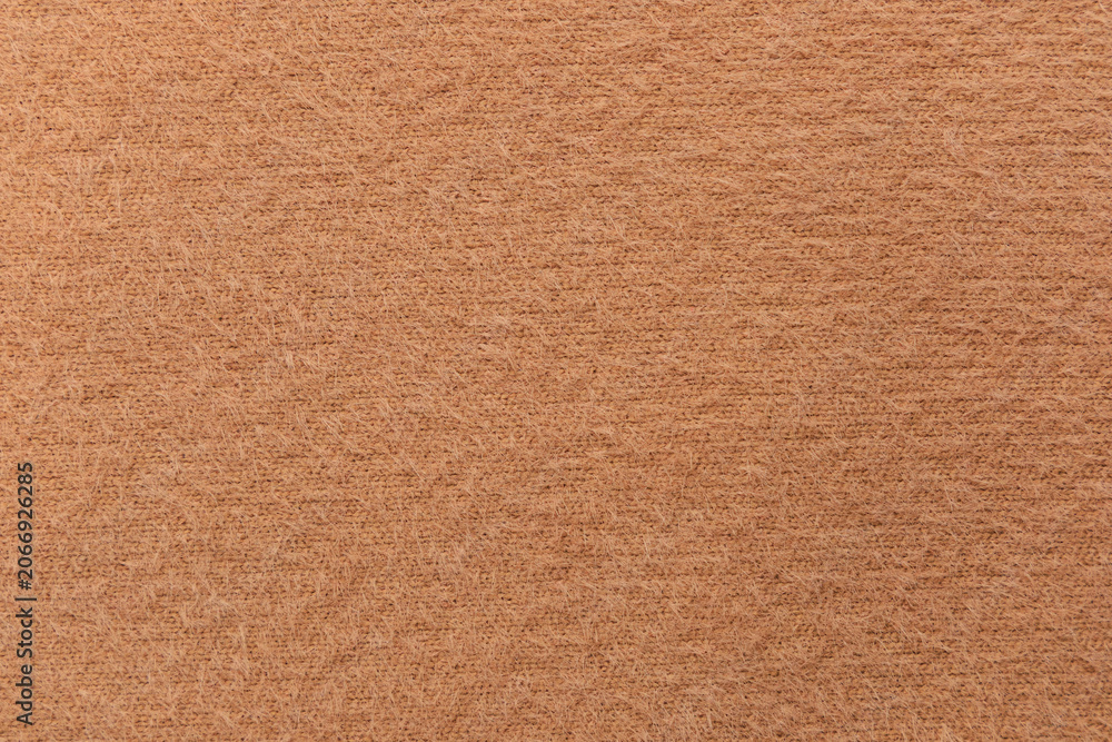 Fototapeta premium Fluffy beige cotton fabric texture for design and creative projects with space for text and graphics to showcase content clearly