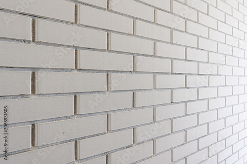 Photography clean white brick wall features rectangular bricks laid in a staggered bond patt