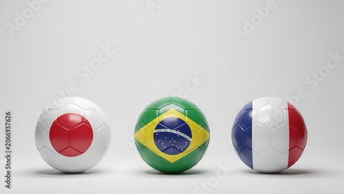 Three soccer balls representing japan brazil and france displayed on a light gray background ball football sphere sports game round