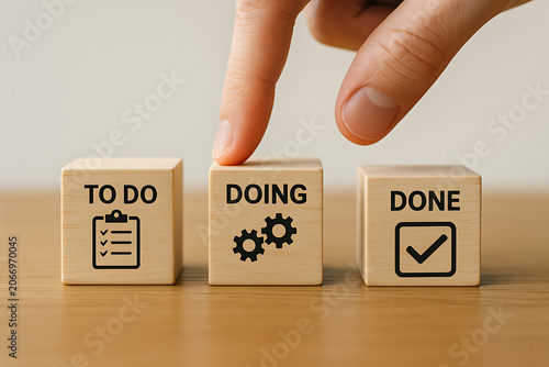 Visualizing project management a hand interacts with blocks labeled to do doing and done