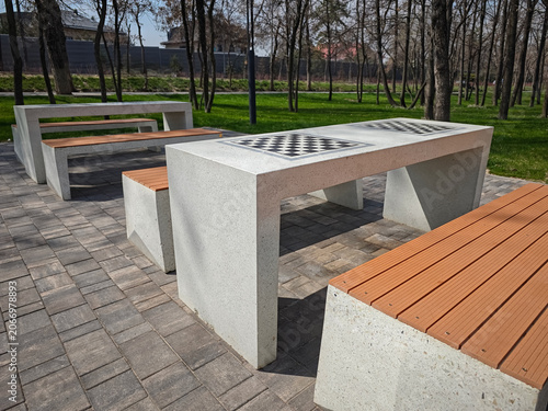 Photography Outdoor chess table with benches in a modern park