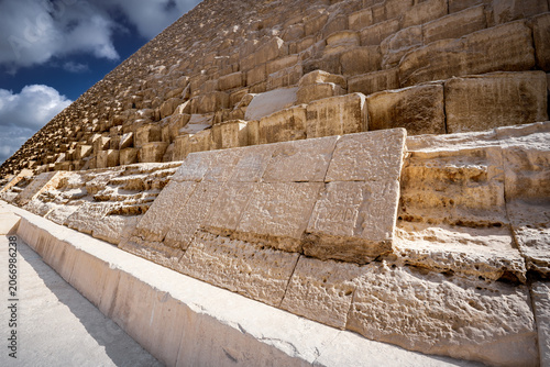 Fragment of limestone casing formerly covering King Khufu Great Pyramid on Giza plateau, Cairo, Egypt