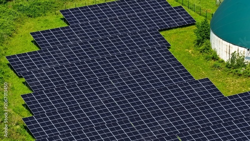 Quadro su tela Aerial View of Large Solar Farm and Biogas Dome in Germany