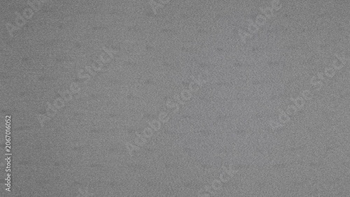 Abstract gray pattern with small dots on a textured background