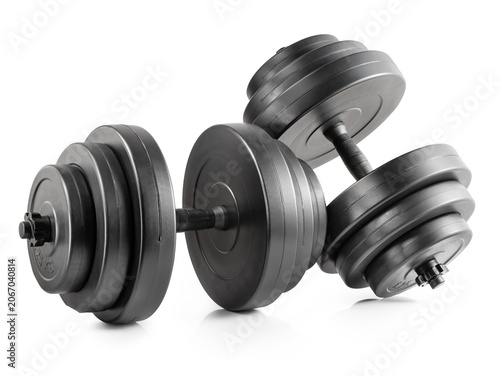 Black adjustable dumbbells with stacked weight plates isolated on white background. Fitness equipment, home gym and strength training concepts.