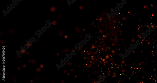 Картината върху платно Glowing embers and fire particles drifting through dark background