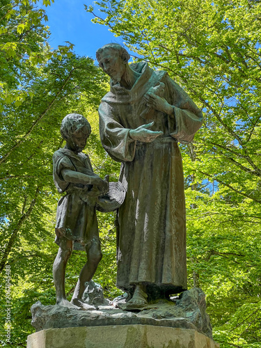 A statue of St. Francis among the trees, near the Franciscan monastery in La Verna, Italy, at the site where St. Francis received the stigmata