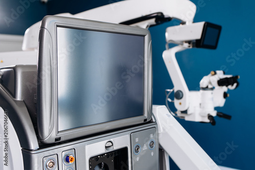 Fotografie Surgical system for eye operations featuring a control panel and monitor, with a