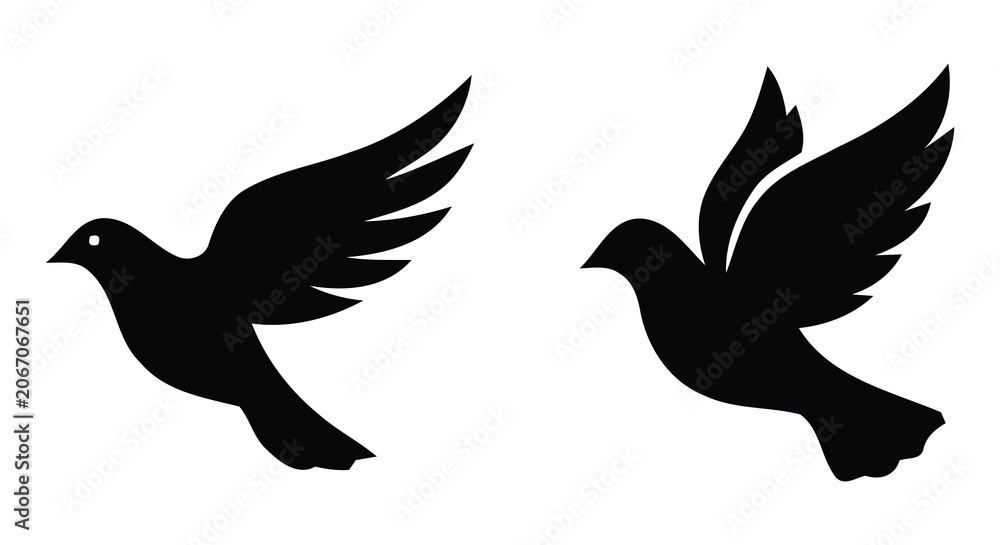Fototapeta premium Two black silhouette doves in flight on white background