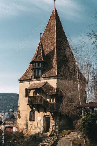 Medieval tower with a tiled roof in the Sighisoara citadel, Romania