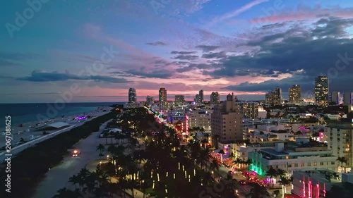 Miami beach iconic night skyline. Miami aerial panorama coastline. Miami south pointe shore dusk. Miami Ocean drive waterfront evening.