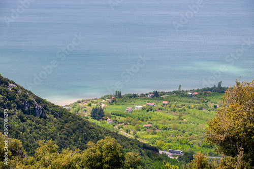 This image showcases Lake Eğirdir in Isparta, Turkey, surrounded by mountainous terrain and greenery.The area is known for natural beauty, including viewpoints from surrounding hills like Karatepe.Vis