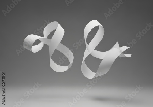 Two white paper ampersands floating in the air against a neutral gray background