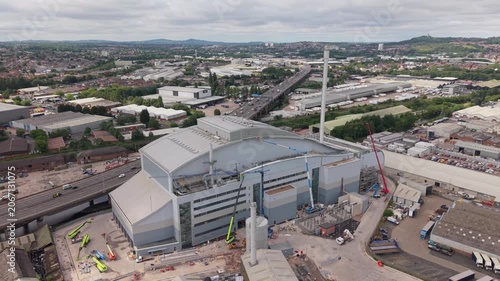 Aerial drone flyover showcasing the scale of the Enfinium Kelvin Energy Recovery Facility in Oldbury, West Midlands, England. Large industrial energy infrastructure located beside the M5 motorway with
