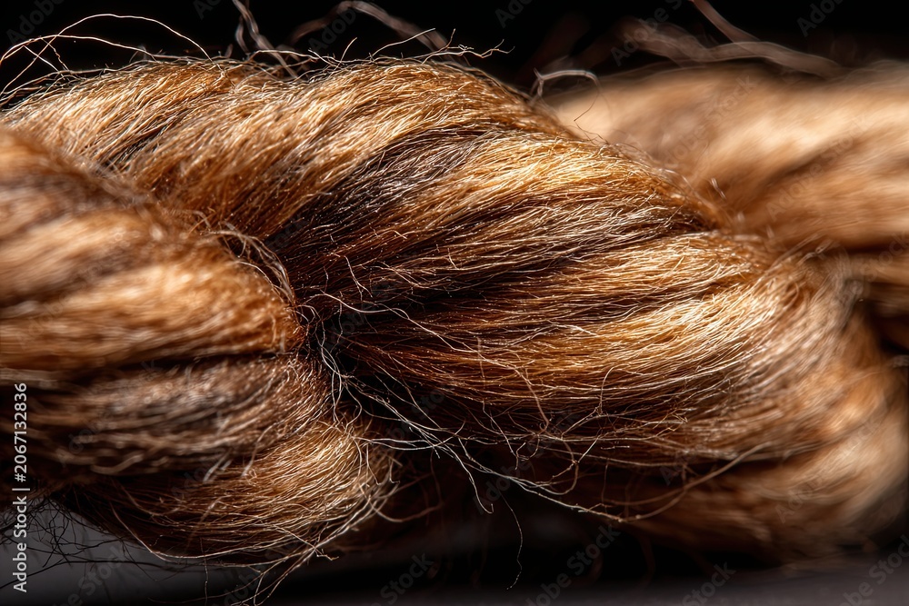 Fototapeta premium Detailed macro view of coarse brown natural fiber rope texture