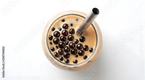 Top view of refreshing milk tea with chewy tapioca pearls and metal straw, popular asian dessert drink beverage