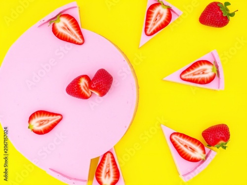 Colorful sliced strawberries on a vibrant background with whole strawberry