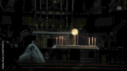 Devout Woman in White Veil Praying at Altar with Holy Monstrance and Candles - 4K