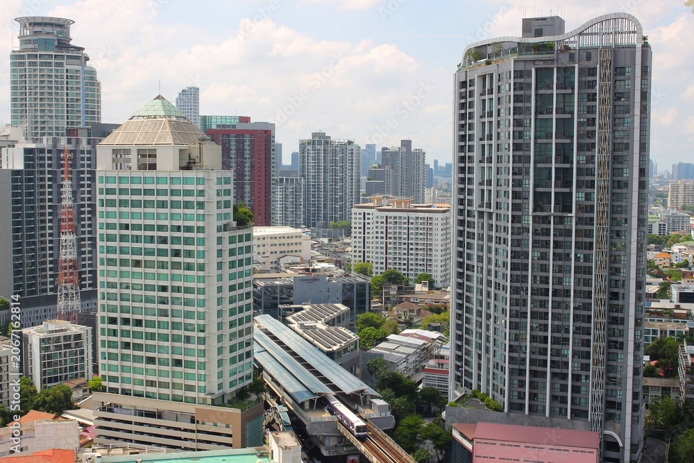 Fototapeta premium High-rise condominiums and urban cityscape around BTS Phra Khanong in Bangkok, Thailand
