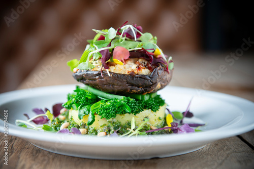 Delightful Gourmet Dish Featuring Grilled Portobello Mushroom With Vibrant Greens