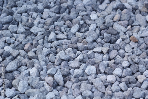 Canvas-taulu A high-angle, close-up shot of a pile of grey crushed stones and gravel, showing a rough texture suitable for construction, roadwork, or landscaping backgrounds