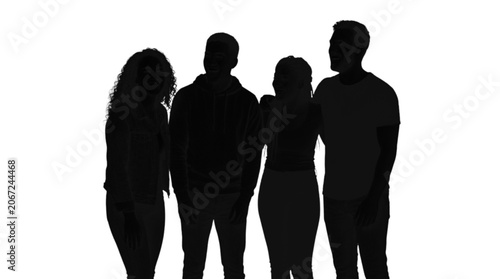 Four silhouettes standing together outdoors in sunlight