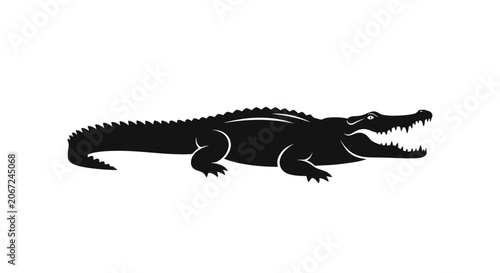 A large black crocodile is crawling on the ground.