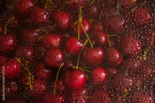 Fresh red cherries with water drops close up