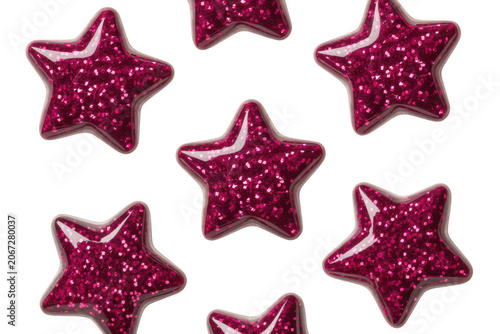 Group of shiny dark pink star shapes with glitter texture isolated on a white background, for festive decorations and