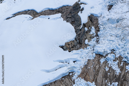 Fotografía Aerial Glacier and Rocky Snowfield on an Alpine Slope in British Columbia, Canad